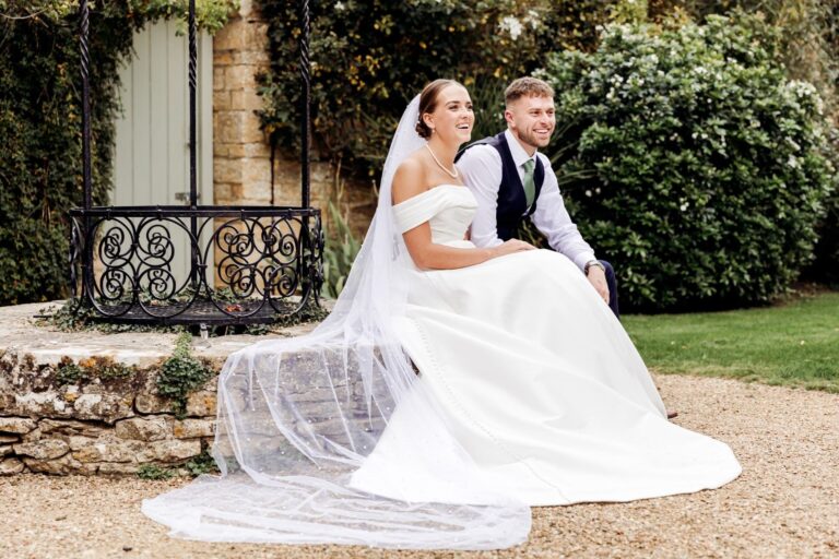 The couple on the wrought-iron bench in the walled garden, The Bay Tree Hotel