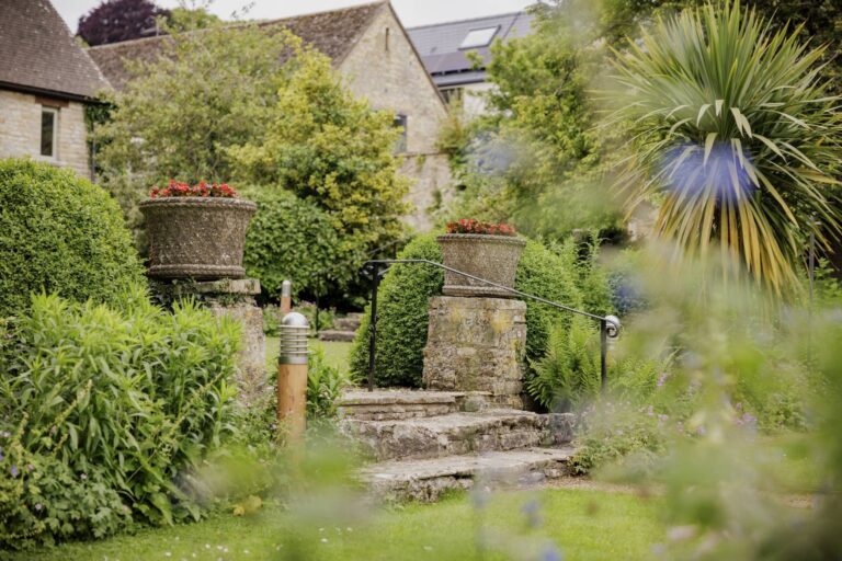 Stone steps and planting in the secret walled garden, The Bay Tree Hotel