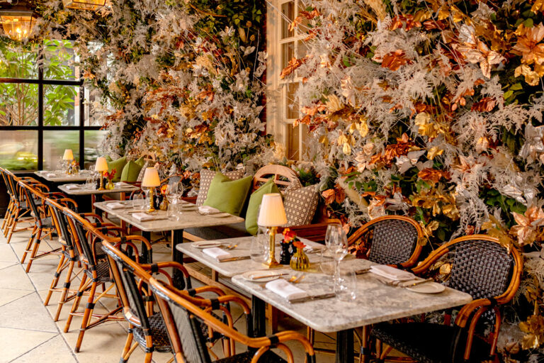 Dalloway Terrace in its winter display, with dried and autumn-toned flowers over the marble-topped tables, The Bloomsbury
