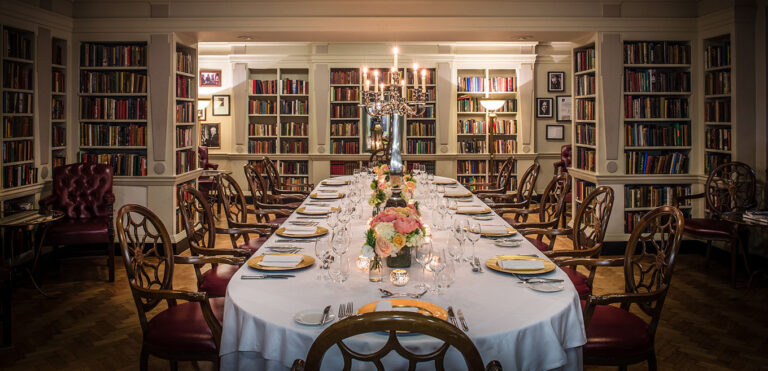 The Seamus Heaney Library laid for a private dinner at one long table under a candelabra, The Bloomsbury