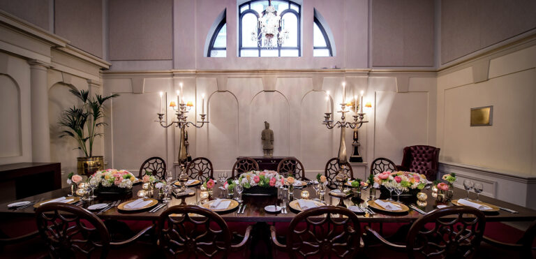 The Chapel, the building's former chapel, set for a candlelit dinner beneath a half-moon window, The Bloomsbury