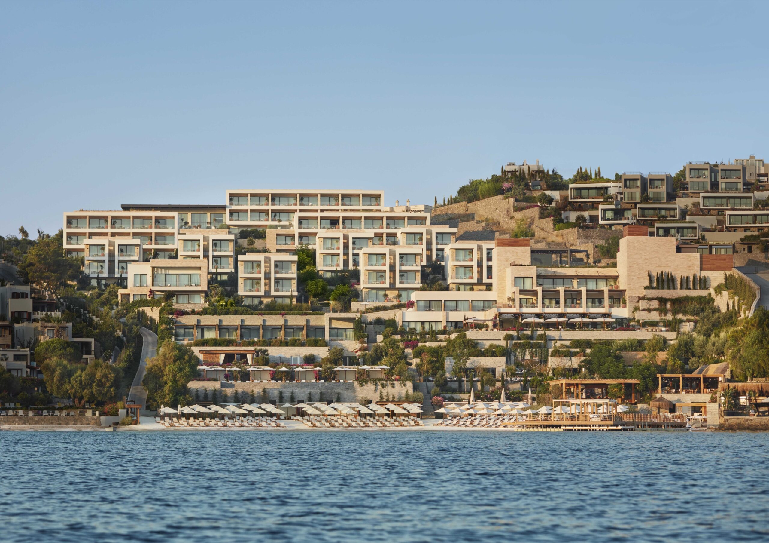 The hotel and its terraces seen from the bay, The Bodrum Edition