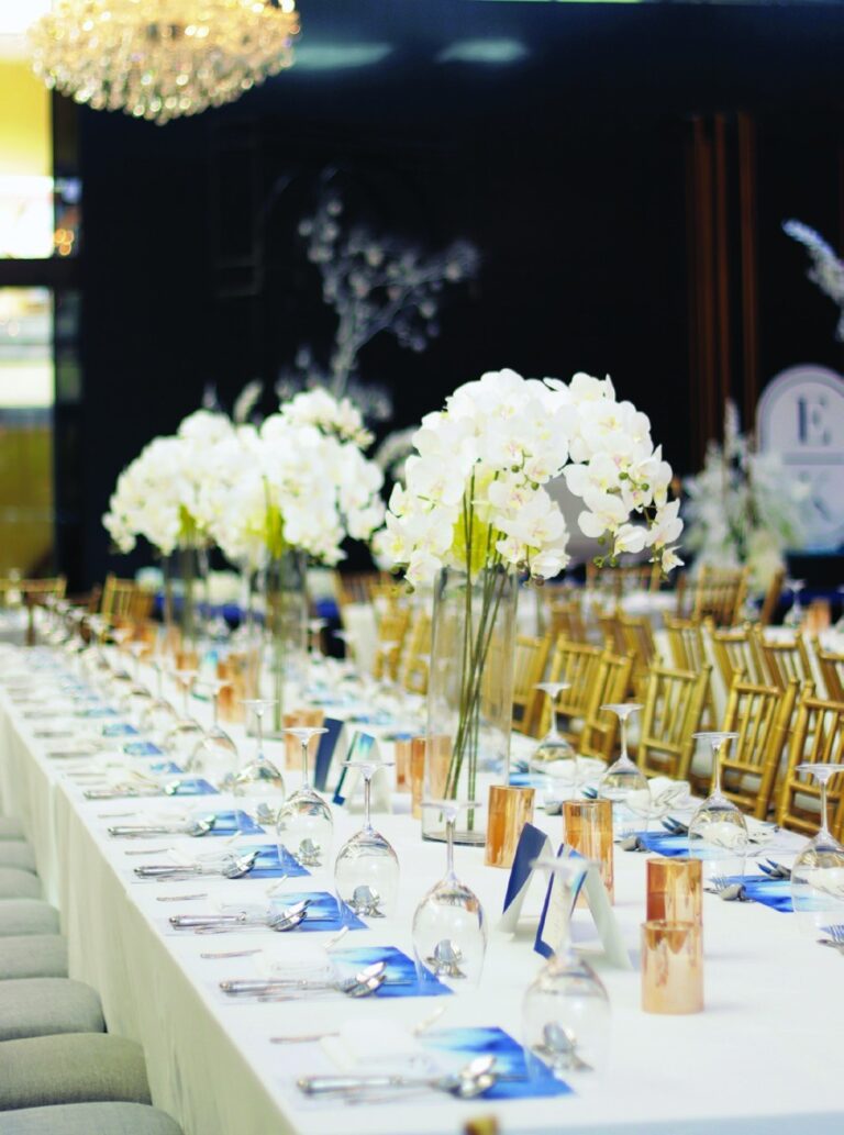 White orchid centrepieces on a banquet table, The Chateau Spa and Organic Wellness Resort