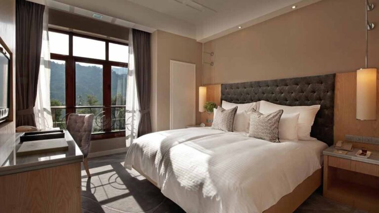 Deluxe Room bed and mountain view, The Chateau Spa and Organic Wellness Resort