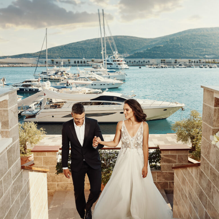 A couple on a terrace above the marina, The Chedi Luštica Bay