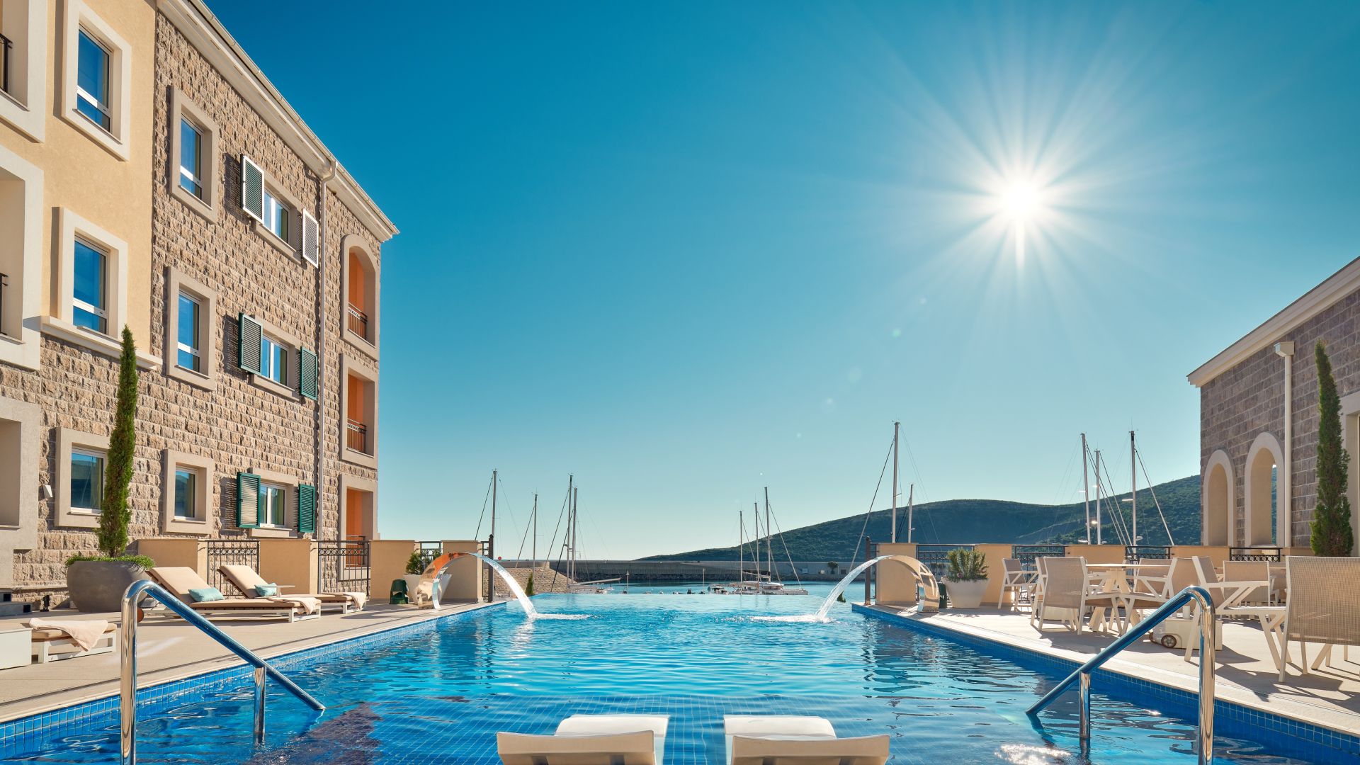 The outdoor infinity pool and sundeck beside the hotel, The Chedi Luštica Bay
