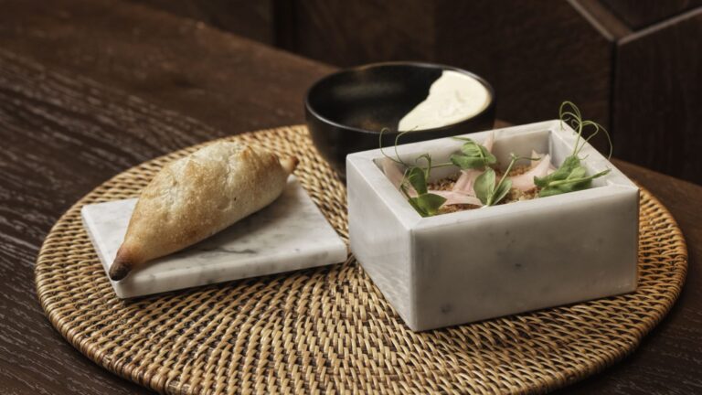 A starter served on a woven mat, The Chedi Luštica Bay