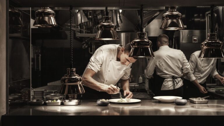 Chefs plating in the kitchen, The Chedi Luštica Bay