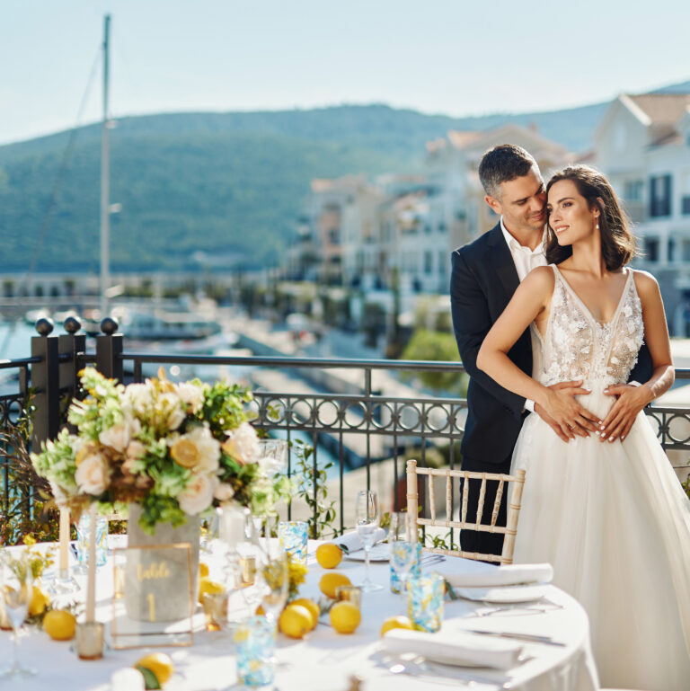 A round table dressed with citrus and white flowers on a marina terrace, The Chedi Luštica Bay