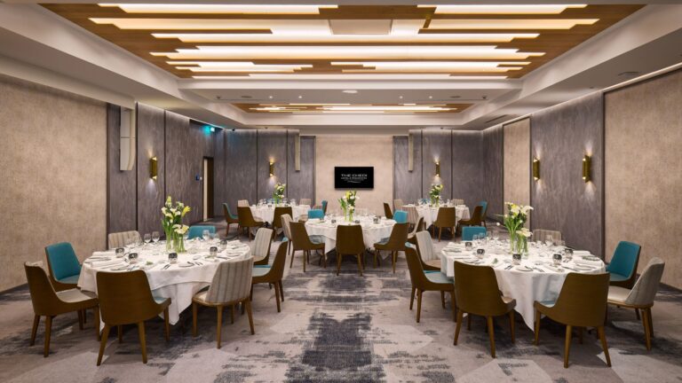The Ballroom set with round tables, The Chedi Luštica Bay