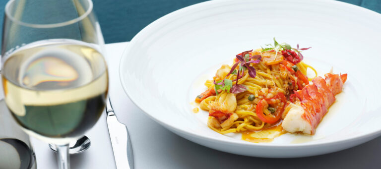 Lobster linguine served with a glass of white wine, The Chelsea Harbour Hotel