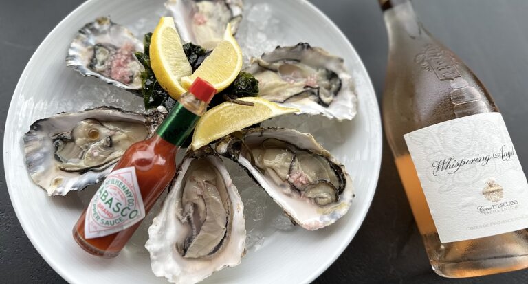 A platter of oysters on ice with lemon and a bottle of rose, The Chelsea Harbour Hotel