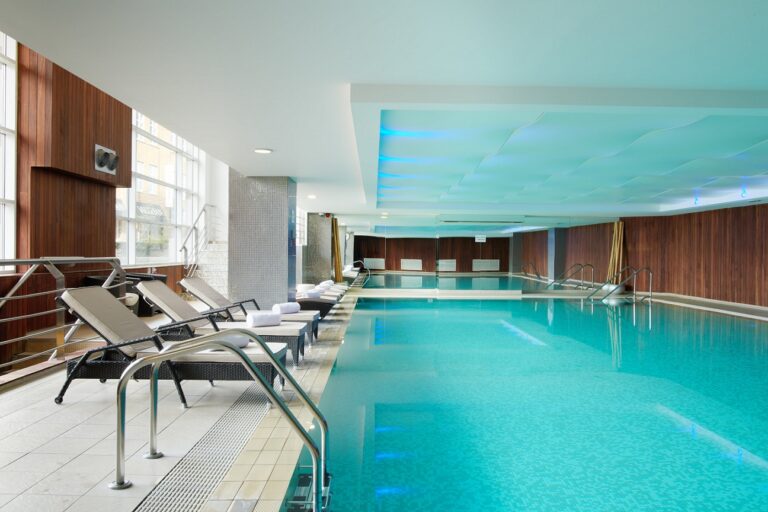 The 17-metre indoor pool at the hotel spa, with loungers along the side, The Chelsea Harbour Hotel