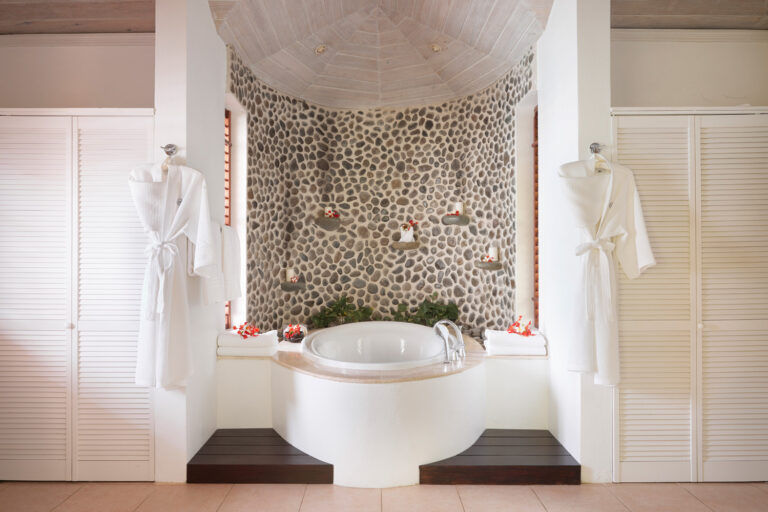 Bathroom with round bath at The Residence, The Cotton House