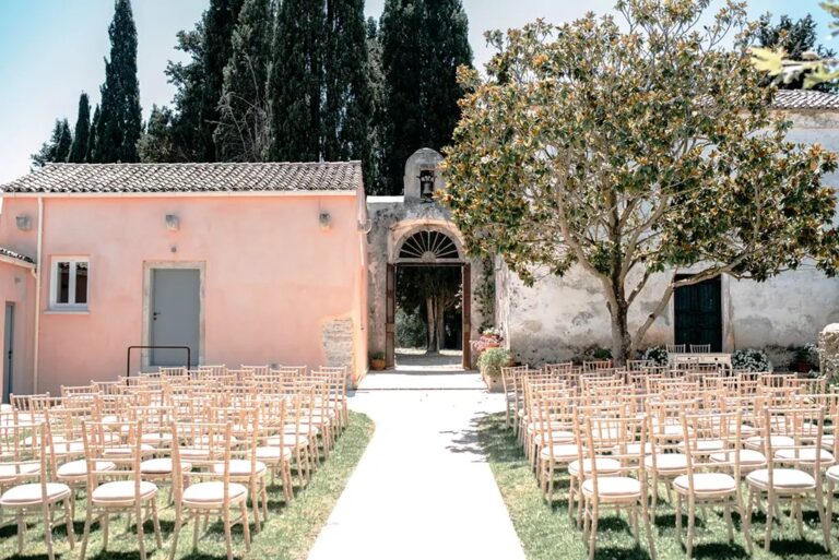 Chairs set for a ceremony in the courtyard, The Courti Estate