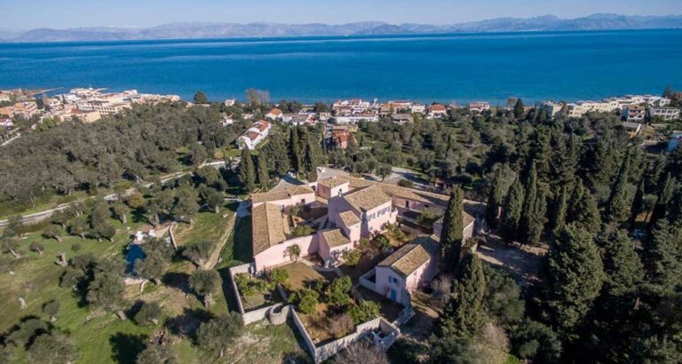 The walled estate seen from above with Messonghi and the Ionian Sea behind, The Courti Estate