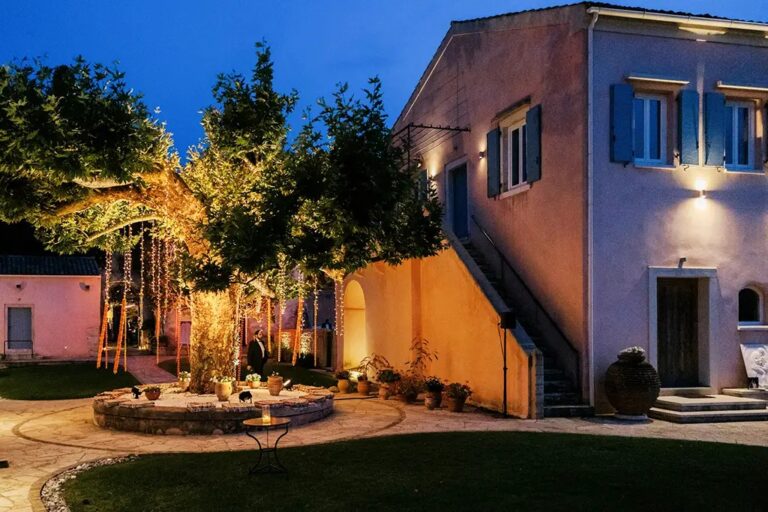 The villa lit at dusk, The Courti Estate
