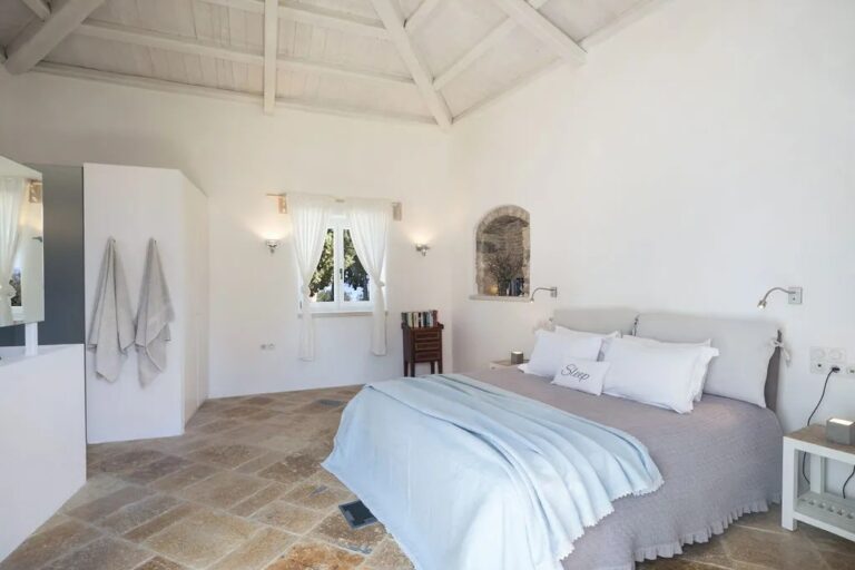 A bedroom with a door to the garden, The Courti Estate