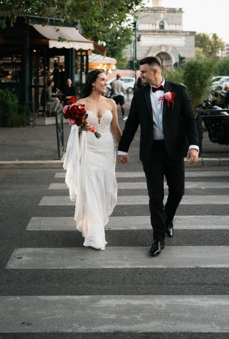 The couple holding hands crossing a pedestrian crossing in the city, The Dream Wedding Lab