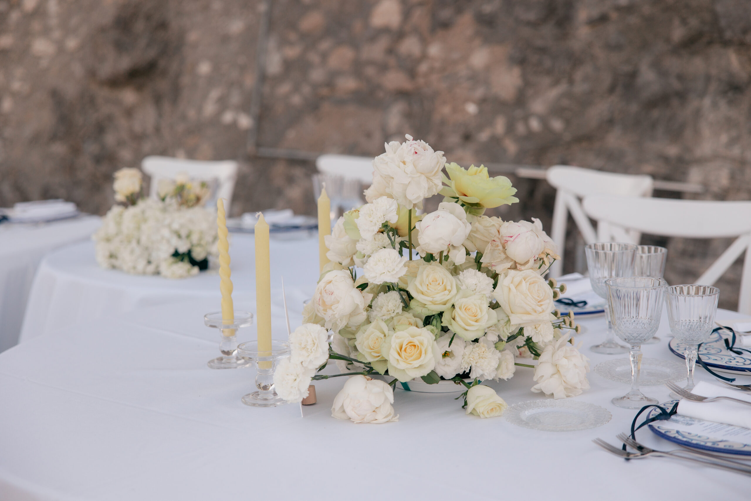 Round table with white roses and taper candles, Torre La Cerniola, Amalfi Coast, The Dream Wedding Lab
