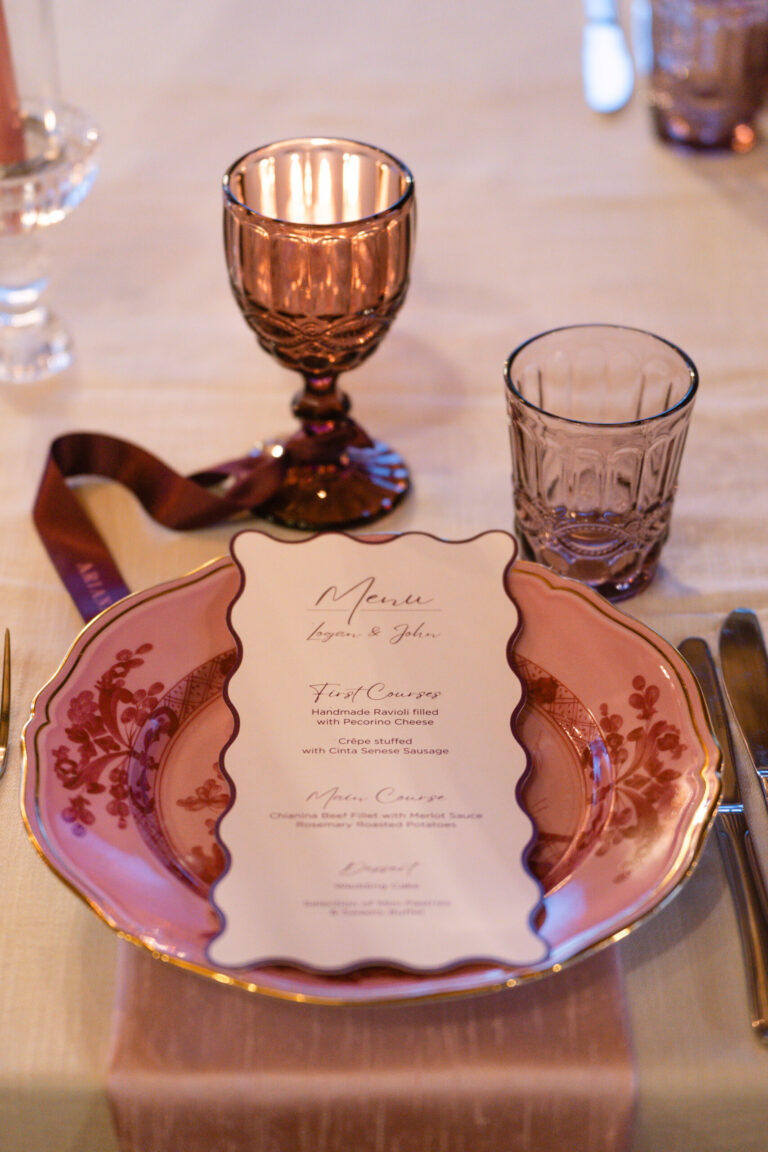 Place setting with pink patterned plate, menu and coloured glassware, Tuscany, The Dream Wedding Lab