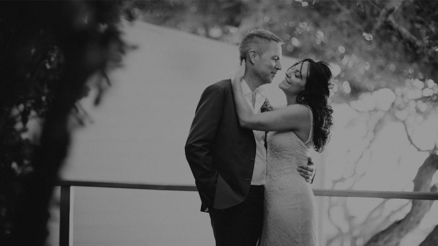 A couple embracing on a terrace, in black and white, The Event Studio