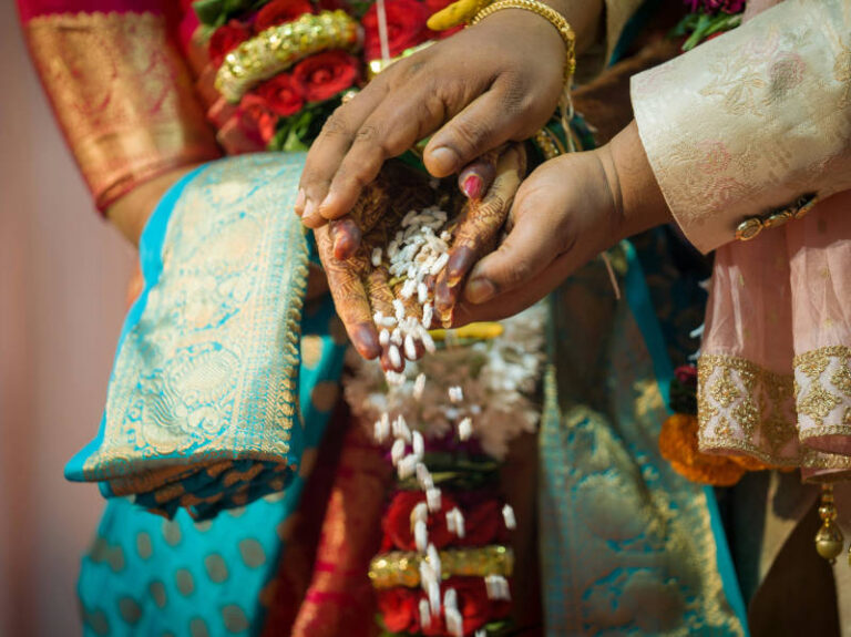 Hands and garlands during an Indian wedding ritual, The Event Studio