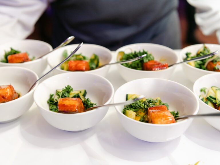 Bowls of salmon and salad prepared for a reception meal, The Event Studio