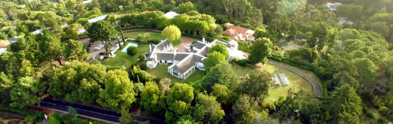 Aerial view of the house within its parkland, The Forum Embassy Hill