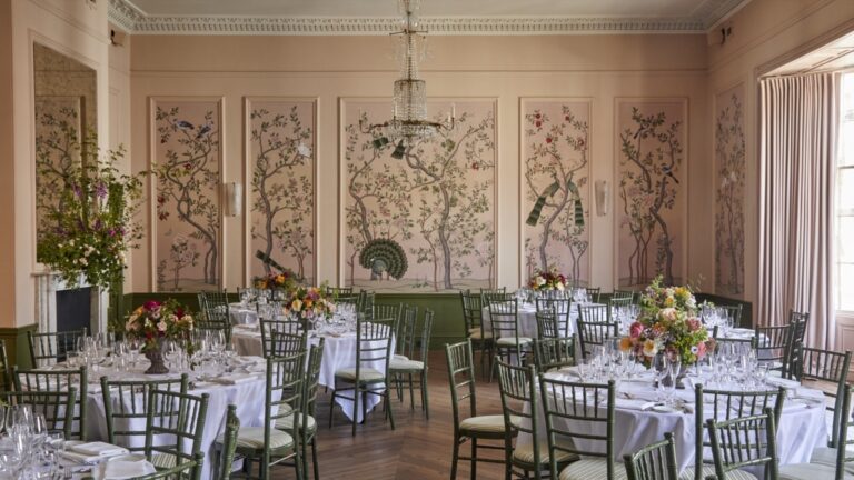 The Ballroom laid for a wedding breakfast on round tables, The George in Rye