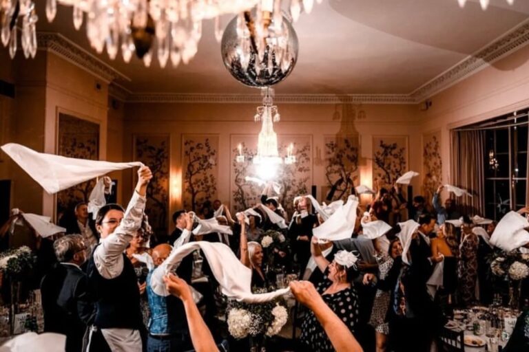 The Ballroom in full swing, napkins waving beneath the chandeliers, The George in Rye