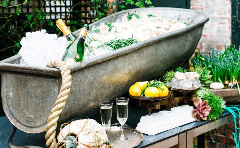 Champagne on ice in a vintage bath, with oysters and lemons, The George in Rye