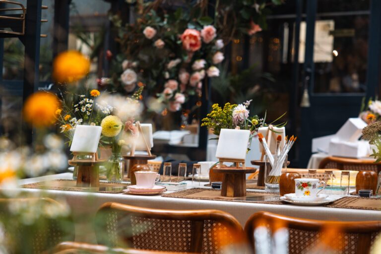 Tablescape detail, roses and candles along the table, The Greenhouses