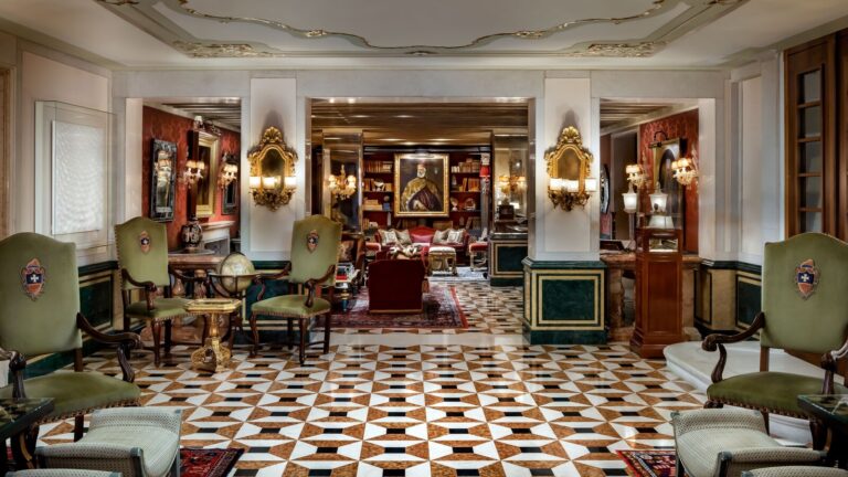 A library salon, panelled and gilded, The Gritti Palace
