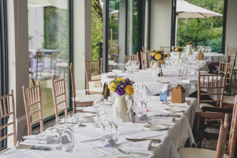The glass-walled restaurant laid with long tables for a wedding breakfast of about thirty, The Horn Of Plenty