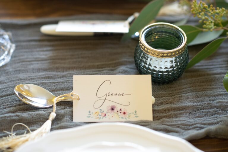 Place card on a styled table with glassware, The Hummingbird Card Company