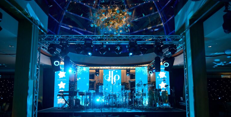 A live band on the stage in Palm Court during an evening celebration, The Hurlingham Club