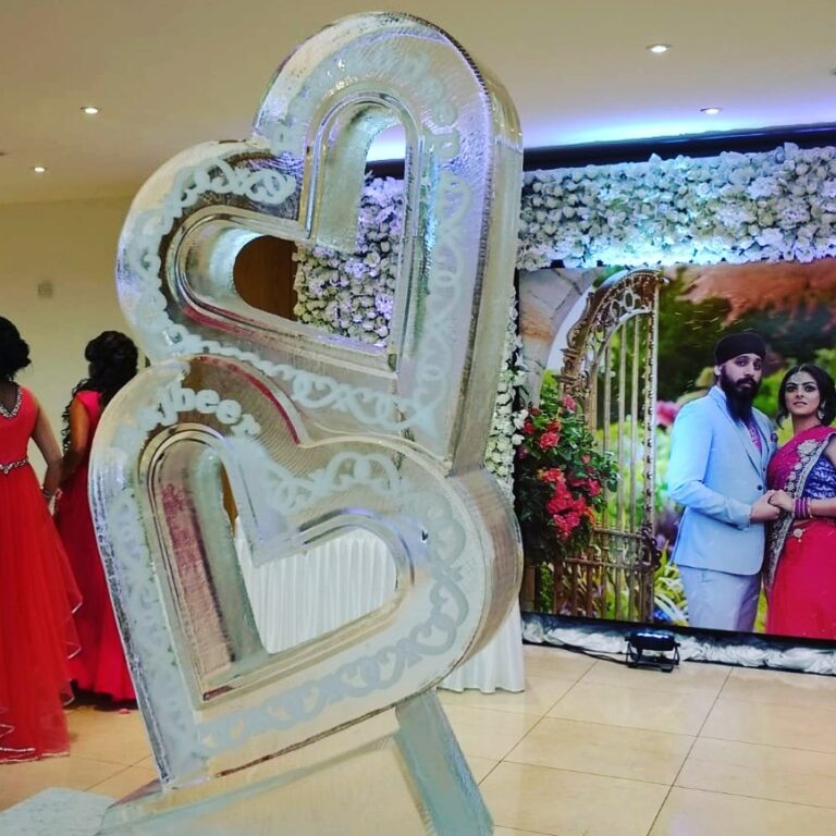 Entwined hearts wedding ice sculpture with engraved detail at a wedding reception, The Ice Box