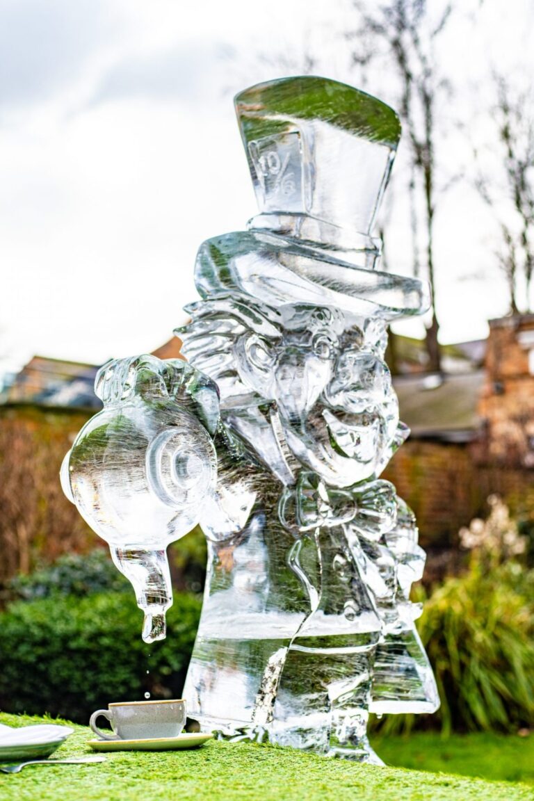 A carved ice figure of the Mad Hatter pouring tea, The Ice Box