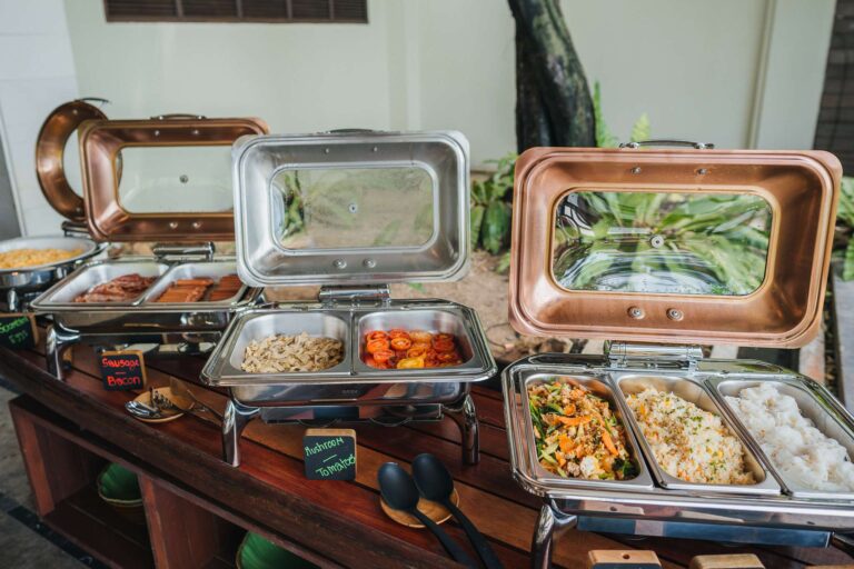 Hot dishes in chafing dishes at the buffet, The Kala Samui