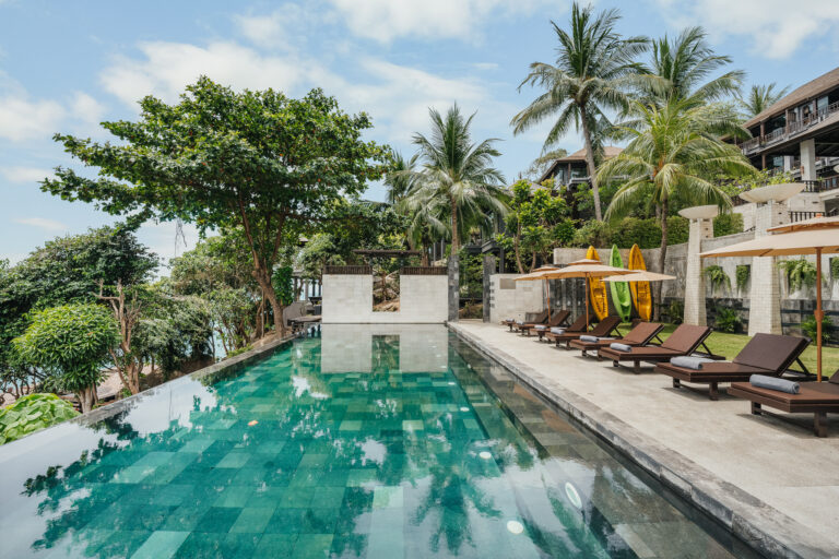 The infinity pool and sun loungers looking over the sea, The Kala Samui