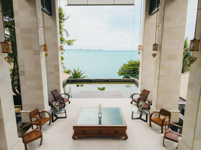Open-sided sala with seating framing the sea view, The Kala Samui