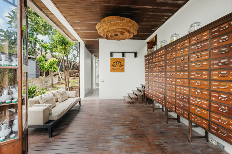 Seating area and wooden cabinet wall at the spa, The Kala Samui