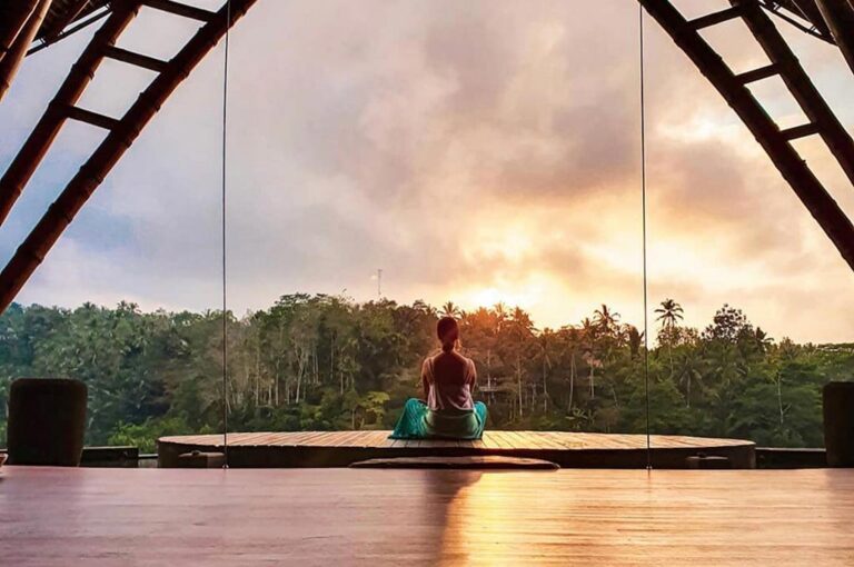 Yoga at the rooftop pavilion at sunset, The Kayon Jungle Resort