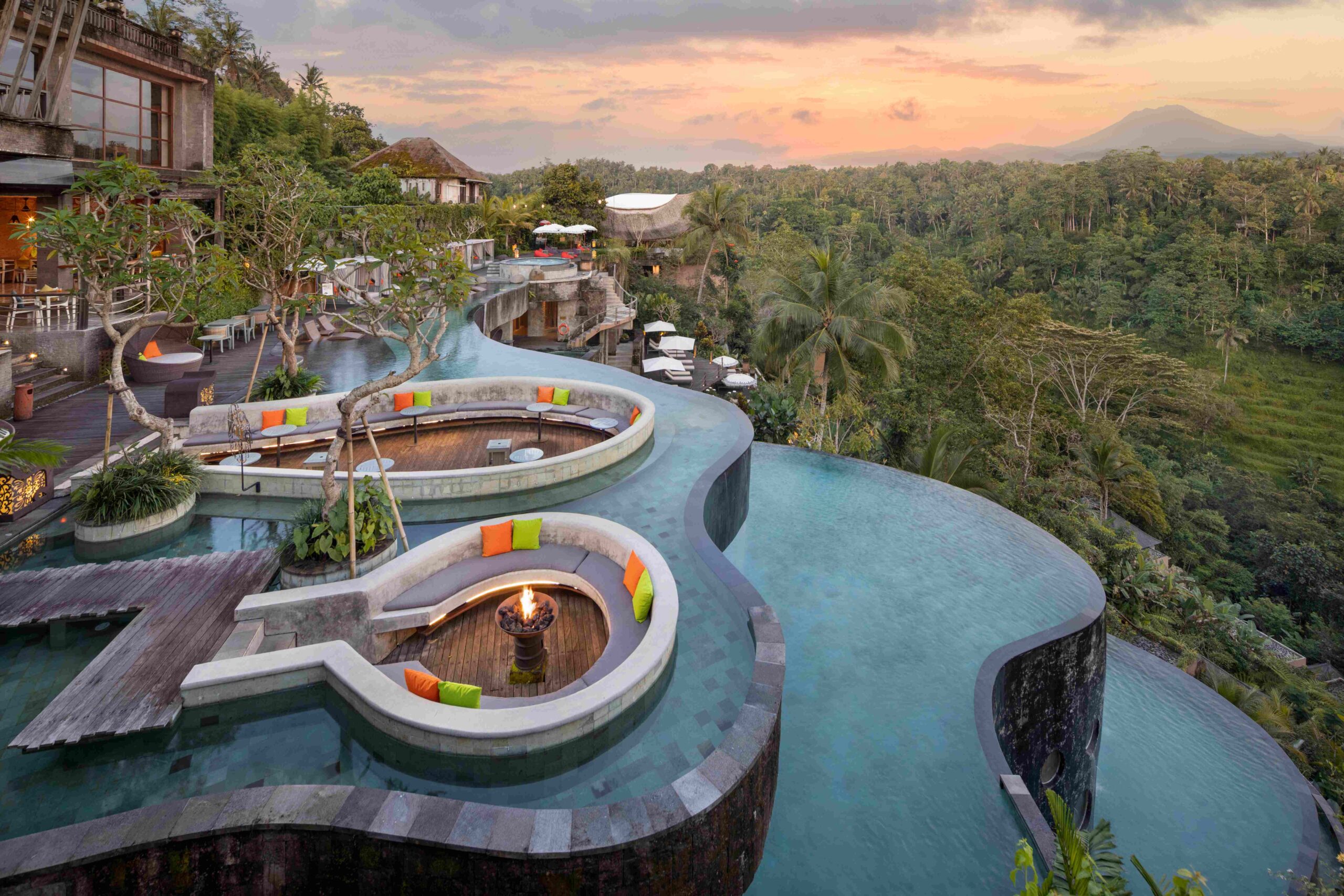 The three-tier pool terraces above the river valley at dusk, The Kayon Jungle Resort
