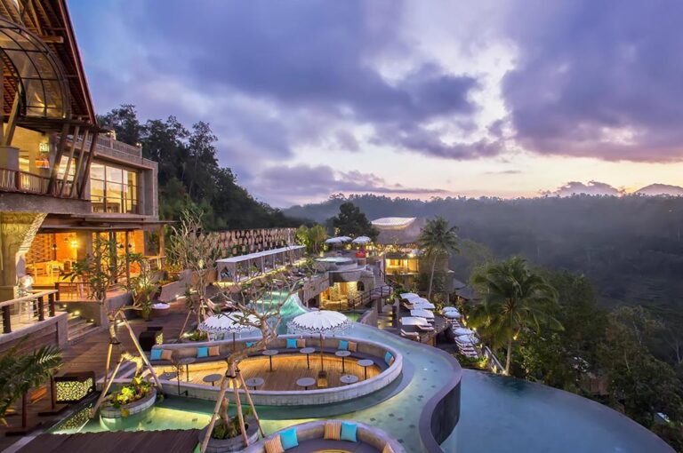 Terraced pools and buildings at sunset, The Kayon Jungle Resort