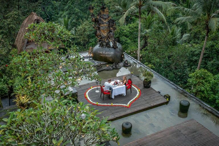 A candlelit table for two on the sky roof deck, The Kayon Ubud Resort