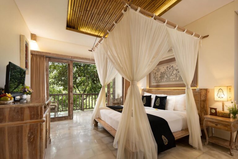 Kayon River Suite bedroom with canopy bed, The Kayon Ubud Resort