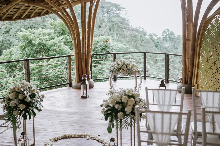 Puspaka chapel with flower arrangements and white chairs, The Kayon Valley Resort Ubud