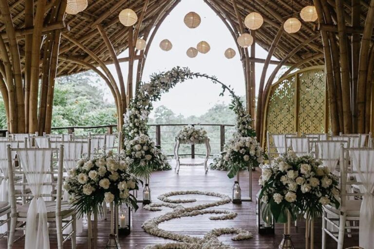 Ceremony aisle with flower petals and an arch of flowers, The Kayon Valley Resort Ubud